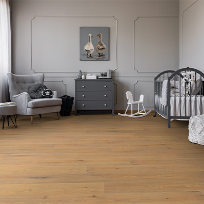 warm toned hardwood flooring in nursery with cohesive colour palette